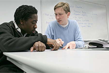 student working with a tutor