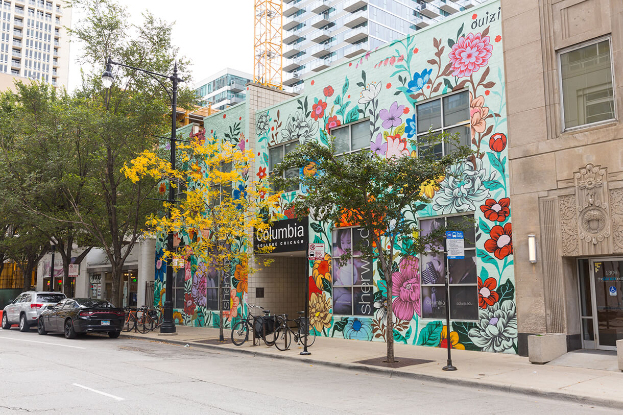 external Columbia building with colorful floral mural