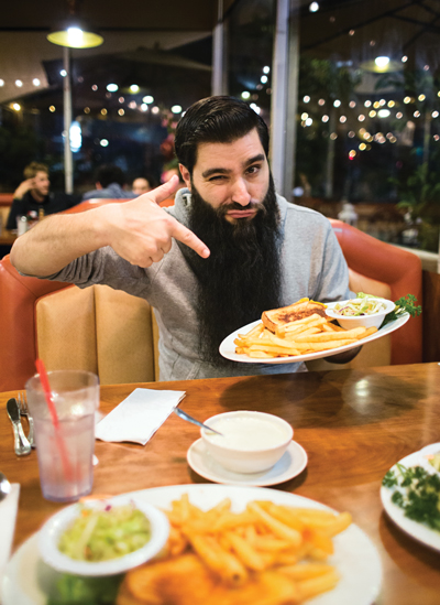 Jordan vogt-roberts enjoys a grilled cheese at Astro Diner in Los Angeles
