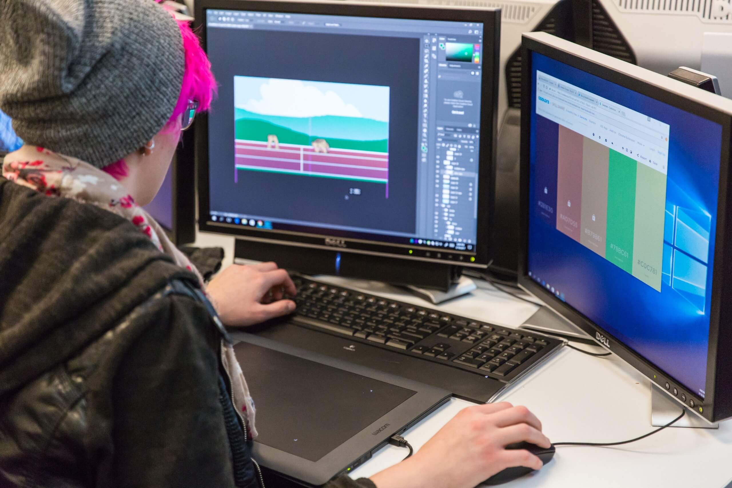 person working on gaming computer screen