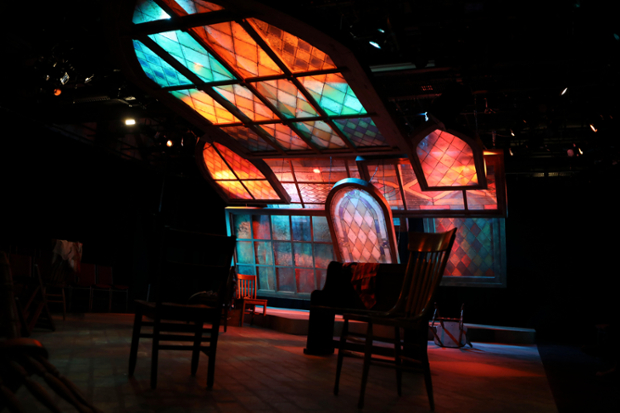 theater stage set with stained glass background