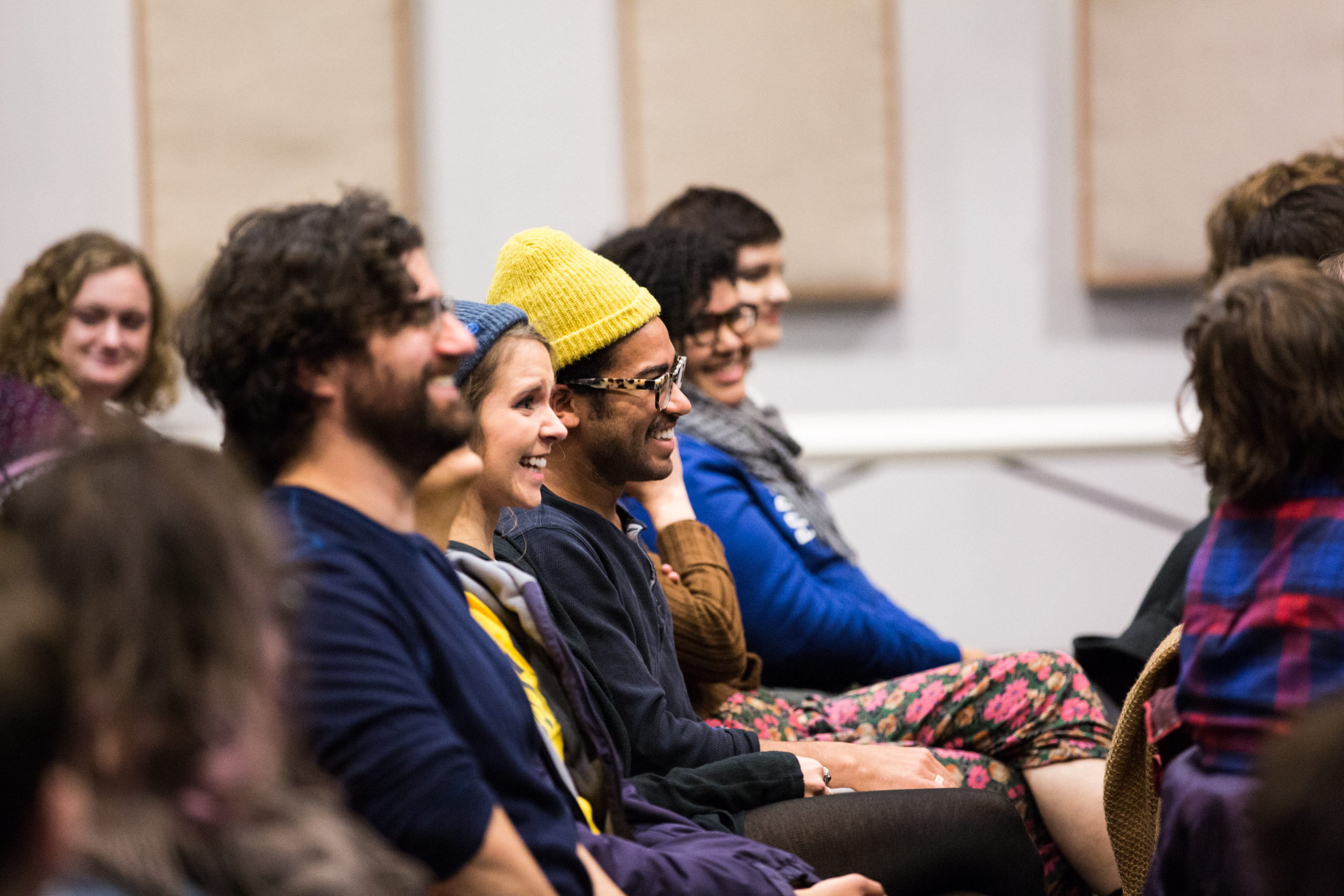 audience listening to presenter reading