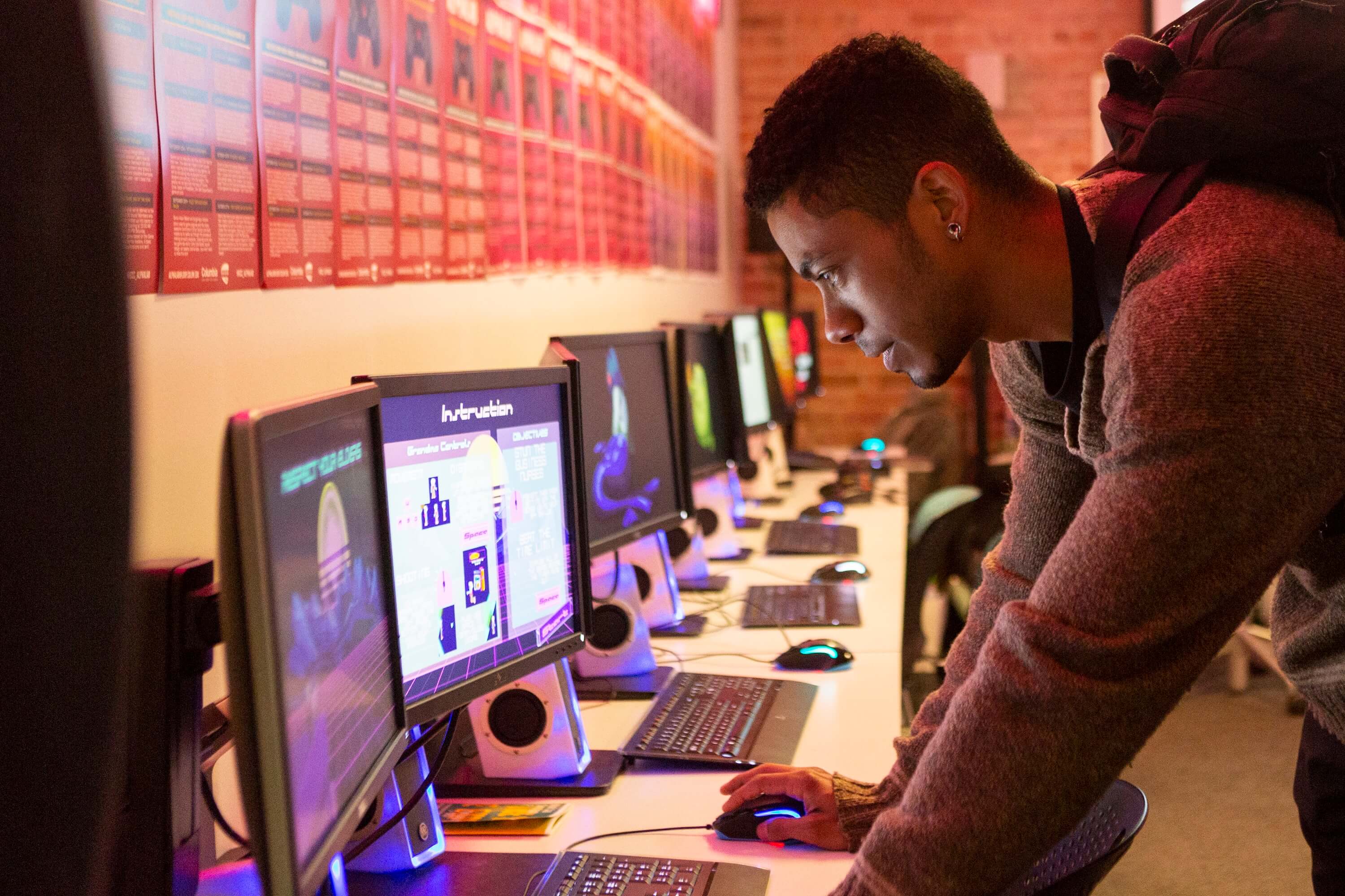 Student playing student-produced game at Manifest