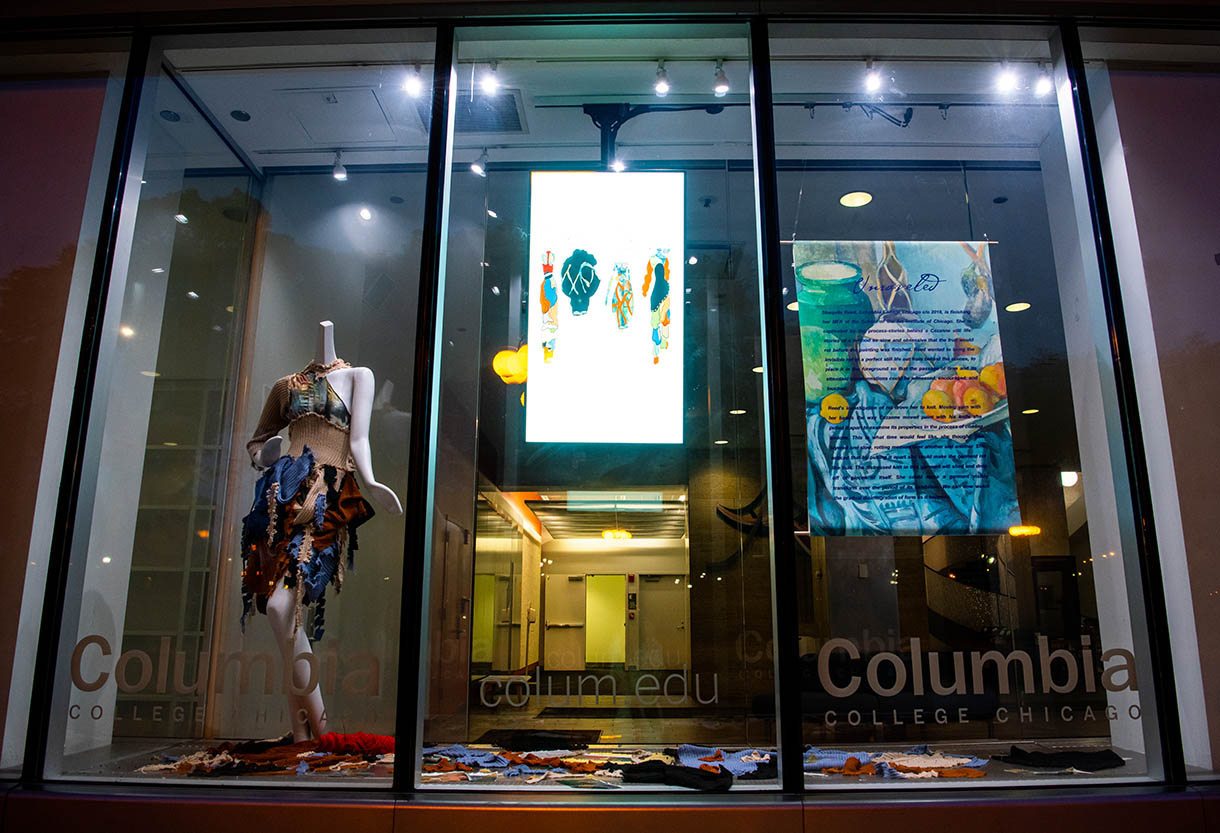 fashion display in window along street