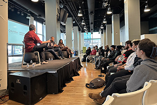 Students gather to participate in a discussion with AMA CEO Bennie Johnson, Board Chair of AMA and Columbia alumna Lisa Bowman, and Vanessa Torres, Columbia alumna and member of the AMA Professional Chapters Council. 