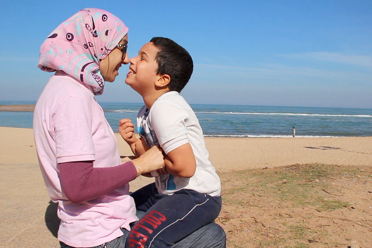 Image from Jackie Spinner's documentary, two people on beach in Morocco. 