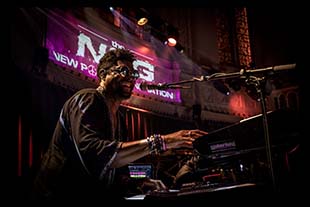 Morris Hayes performing in concert at the keyboards.
