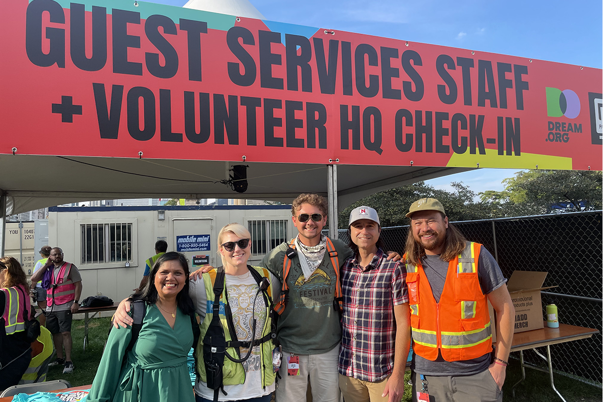 photo of group in front of both at lollapalooza