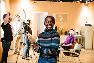 photo of person standing in front of movie set