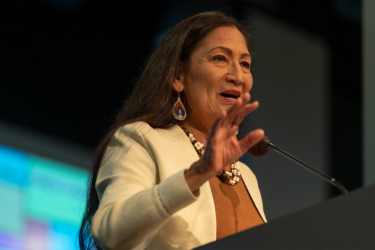 deb haaland at podium speaking at event