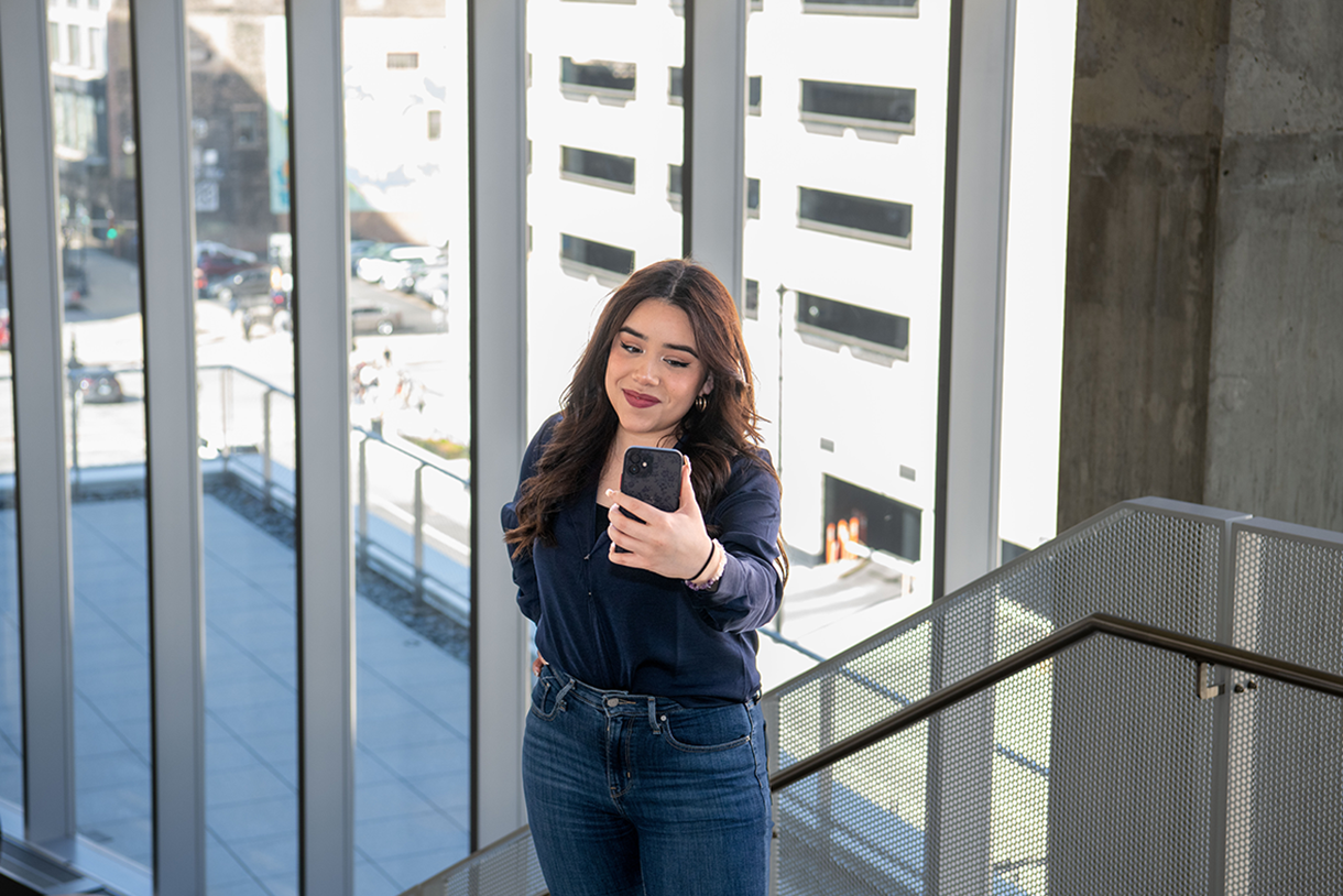 alexia tamayo using her photo to film herself for social media 